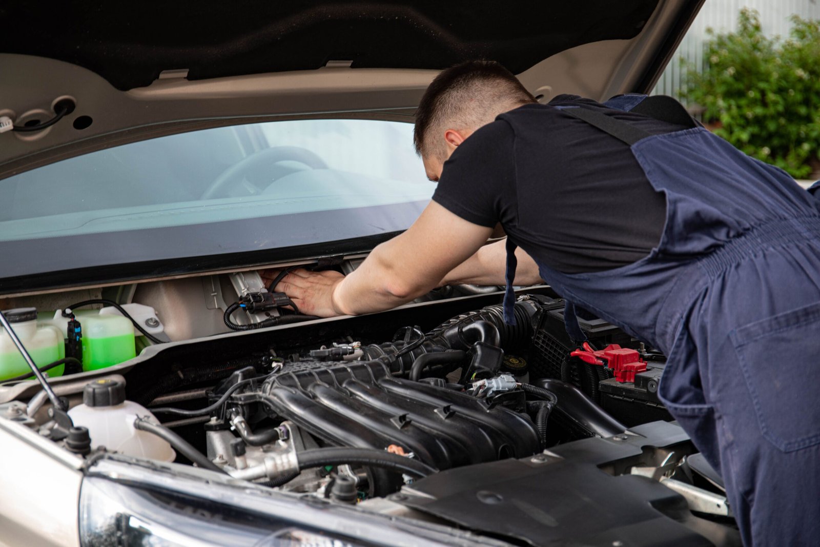 Mechanic inspecting a car engine